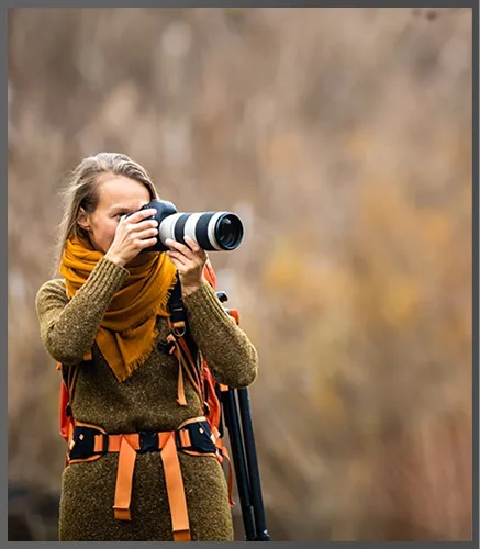 Photographer with a telephoto lens on a real estate shoot